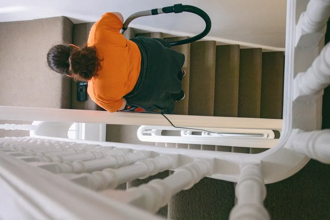 Duct cleaning technician with HEPA vacuum in Austin