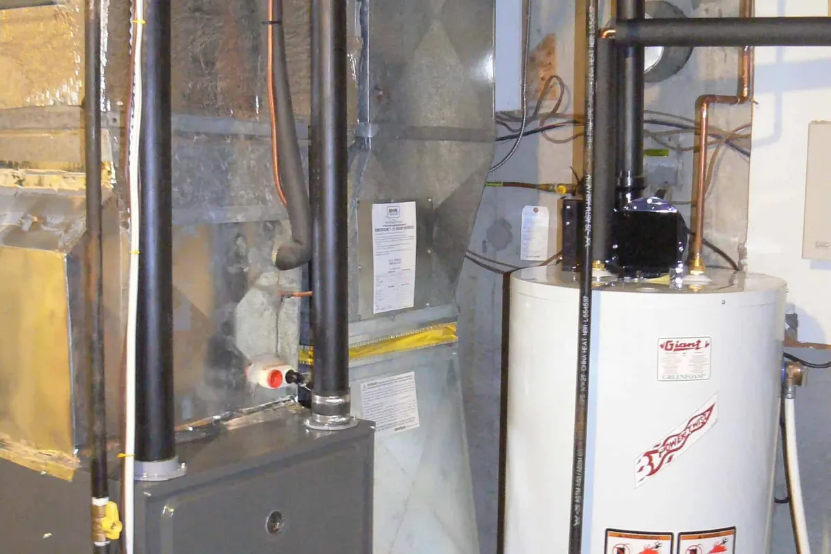 New high-efficiency gas furnace installed in a Austin basement mechanical room
