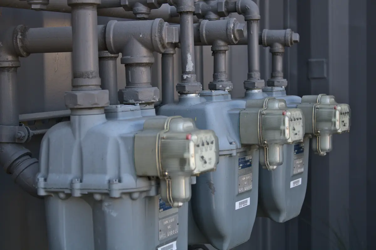 Pool heater installation with gas piping in a Austin backyard